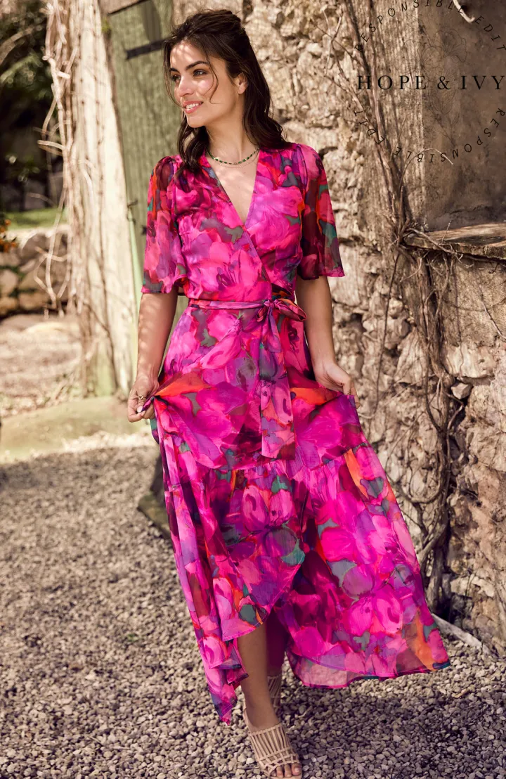 the_corinne_flutter_sleev_1.webp Hope & Ivy Occasionwear<The Corinne Flutter Sleeve Maxi Wrap Dress (Bright Pink)